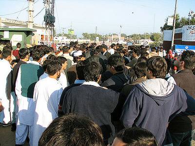 Photographie de migrants à la frontière pakistanaise