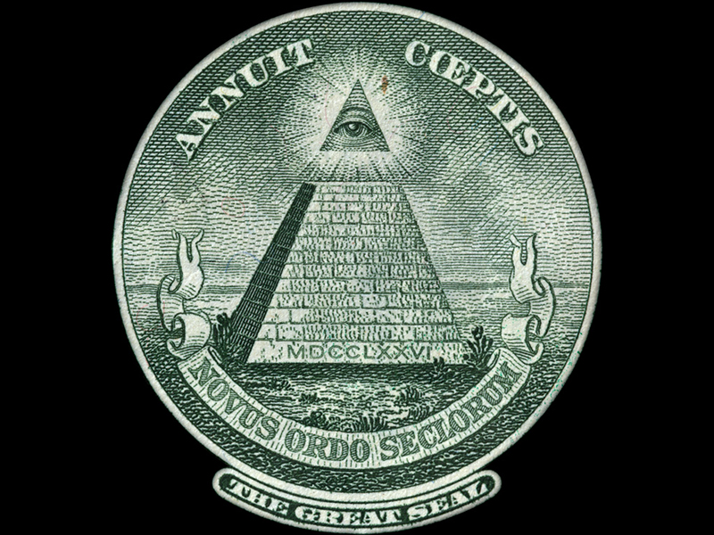 Symbole de l'œil surmontant la pyramide sur le billet d'un dollar américain 